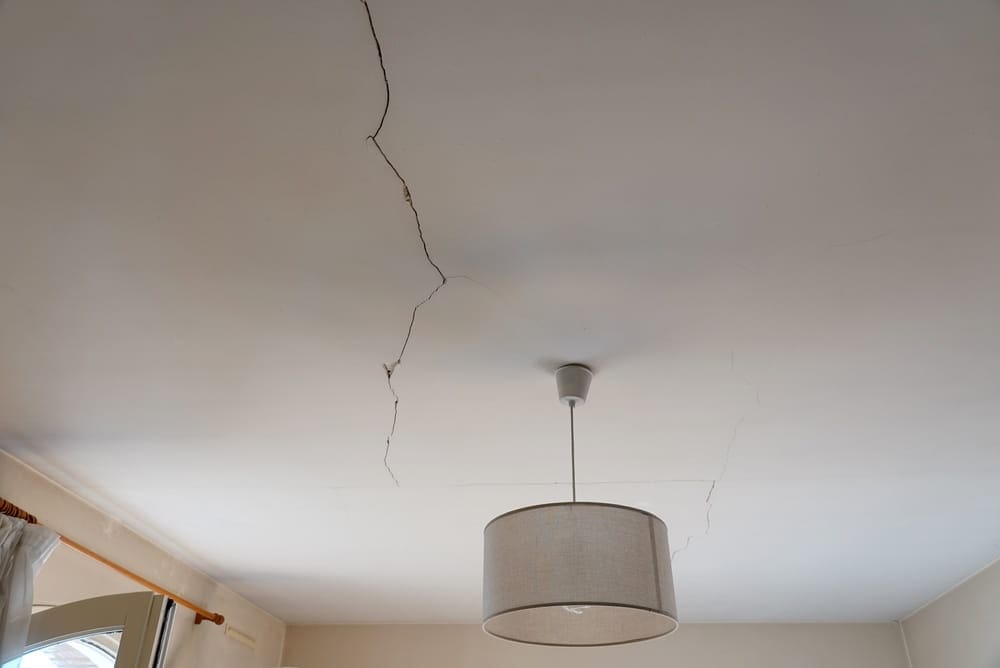 Read more about the article Why Is My Ceiling Cracking? (Stress Cracks vs. Structural Issues)